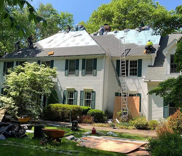 Benefits of residential roof replacement showcasing improved energy efficiency and enhanced curb appeal.