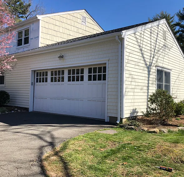 Efficient new siding installation in progress with a team ensuring precision and timely completion.