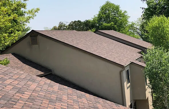 New shingle roof installation on a residential home with durable asphalt shingles.