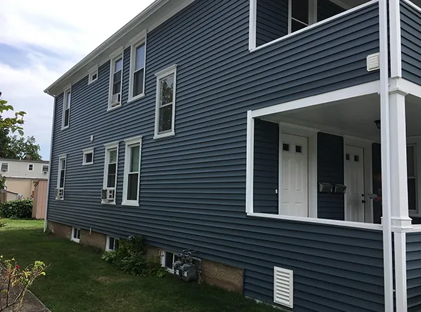 Professional vinyl siding installation transforms a home's exterior with modern, low-maintenance panels.